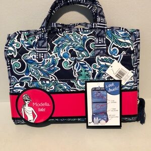 Conair travel cosmetic clutch.